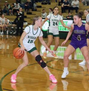 Dave Logan/for Peninsula Daily News 
Port Angeles Teanna Clark is guarded by Onalaskas Renzy Marshall during the Roughriders 74-52 loss to the Loggers.
