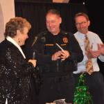 Deb Carlson, president of the Sequim-Dungeness Hospital Guild, presents a check for $9,585 to Deputy Police Chief John Southard and City Manager Matt Huish to help purchase three automated external defibrillators (AEDs) for three new vehicles and new AED pads and first aid supplies for the full fleet. (Matthew Nash/Olympic Peninsula News Group)