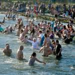 About 150 to 200 people jumped into 49-degree water at Hollywood Beach on Jan. 1, 2025, for the 37th annual Polar Bear Dip. The air temperature was about 39 degrees, so it was a short, brisk dip that they did three times. There was a beach fire to warm the dippers afterward as well as two portable saunas in the parking lot. The event was sponsored by Volunteer Hospice of Clallam County under the leadership of organizer Dan Welden. Hot drinks, tasty muffins and a certificate for participants were available. (Dave Logan/for Olympic Peninsula News Group)