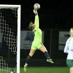 Port Angeles' Kennedy Rognlien makes a leaping save late in the game against Hockinson in the 2A state playoffs, one of 16 saves she made in the game. (Taylor Balkom/The Columbian)