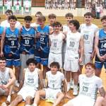 Members of the Port Angeles boys basketball team and the Surfcoast Chargers, a team based in Melbourne, Australia, get together for photos after their game Friday night in Port Angeles. (Pierre LaBossiere/Peninsula Daily News)