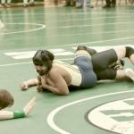 Forks Orlando Camacho waits for the official to call the match as he nears a pin against North Kitsaps Albie Pedersen at 113 pounds. Camacho was eventually awarded a pin. Boys and girls from Port Angeles, Sequim, Forks and East Jefferson competed in the all-day tournament. (Dave Logan/for Peninsula Daily News)