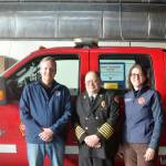 From left, state Public Lands Commissioner Dave Upthegrove, Quilcene Fire Rescue Chief Tim Mckern and Quilcene Fire Rescue Commissioner Marcia Kelbon. (Elijah Sussman/Peninsula Daily News)