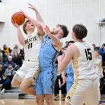 Peninsula Colleges Gus Halberg (Port Angeles High School) goes up for a shot against Whatcom on Saturday. Halberg had a crucial 3-point shot in the final three minutes of the game. (Jay Cline/Peninsula College)