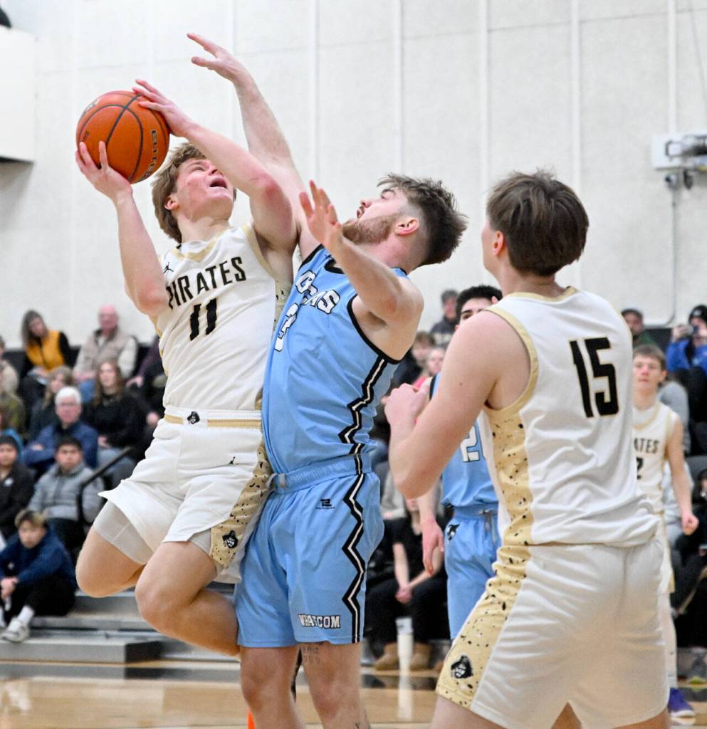 Peninsula Colleges Gus Halberg (Port Angeles High School) goes up for a shot against Whatcom on Saturday. Halberg had a crucial 3-point shot in the final three minutes of the game. (Jay Cline/Peninsula College)