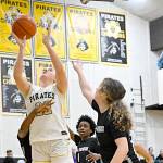 Peninsula College's Makena Patrick (22) is surrounded by Whatcom players in the paint Saturday in Port Angeles. Patrick had 16 points and 12 rebounds in a 83-46 Peninsula win. (Jay Cline/Peninsula College)