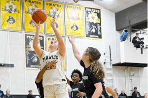 Peninsula College's Makena Patrick (22) is surrounded by Whatcom players in the paint Saturday in Port Angeles. Patrick had 16 points and 12 rebounds in a 83-46 Peninsula win. (Jay Cline/Peninsula College)