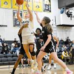 Peninsula Colleges Makena Patrick (22) is surrounded by Whatcom players in the paint Saturday in Port Angeles. Patrick had 16 points and 12 rebounds in a 83-46 Peninsula win. (Jay Cline/Peninsula College)