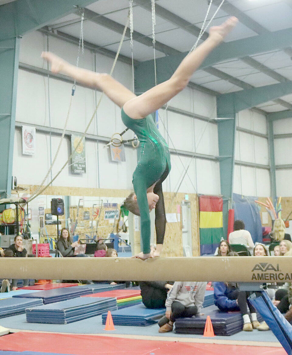 Port Angeles freshman Elyse Brown competes in the Roughriders Olympic League home gymnastics meet at the Klahhane Gymnastics Center in Port Angeles on Monday. Brown finished first in the all-around and the Port Angeles team took third overall against Kingston, Bainbridge and North Kitsap. Sequim freshman Sequim Freshman Emily Bair placed seventh in the floor exercise and Port Angeles Ryah Deleon was ninth on the floor. Coach Elizabeth DeFrang also said sophomores Mya Callis and Denise Galvan performed their best routines all season. The last league meet of the year is Jan. 30 at Bainbridge. (Dave Logan/for Peninsula Daily News)