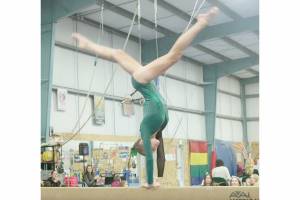Port Angeles freshman Elyse Brown competes in the Roughriders' Olympic League home gymnastics meet at the Klahhane Gymnastics Center in Port Angeles on Monday. Brown finished first in the all-around and the Port Angeles team took third overall against Kingston, Bainbridge and North Kitsap. Sequim freshman Sequim Freshman Emily Bair placed seventh in the floor exercise and Port Angeles' Ryah Deleon was ninth on the floor. Coach Elizabeth DeFrang also said sophomores Mya Callis and Denise Galvan performed their best routines all season. The last league meet of the year is Jan. 30 at Bainbridge. (Dave Logan/for Peninsula Daily News)