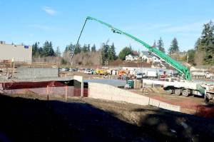 Construction is in the early stages at the new Hurricane Ridge Middle School in Port Angeles. A special cement delivery vehicle brings another batch for the schools foundation. (Dave Logan/for Peninsula Daily News)