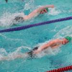 Courtesy Linda Adams (2)
Port Angeles Adam Kaminski (top) and Edward Gillespie dual for the 100-yard freestyle victory during the Roughriders meet with Kingston on Wednesday.