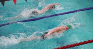 Courtesy Linda Adams (2)
Port Angeles Adam Kaminski (top) and Edward Gillespie dual for the 100-yard freestyle victory during the Roughriders meet with Kingston on Wednesday.