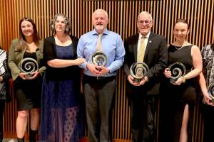 Port Angeles Community Award recipients gather after Saturday nights annual awards gala. From left, they are Frances Charles, Lower Elwha Klallam Tribe, Organization of the Year; Kyla Magner, Country Aire, Business of the Year; Amy Burghart and Doug Burghart, Mighty Pine Brewing, Emerging Business of the Year; Rick Ross, Educator of the Year; Kayla Fairchild, Young Leader of the Year; John Fox, Citizen of the Year. (Paula Hunt/Peninsula Daily News)