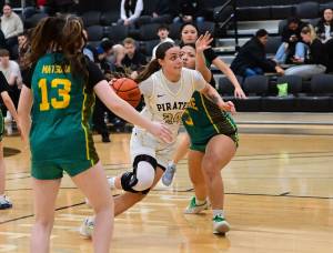Peninsulas Malia Garcia dribbles through the lane during the Pirates 94-9 win over Shoreline at home Wednesday.