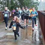 Olympic Peninsula News Group photo by Pierre LaBossiere/
Runners in the Run The Peninsulas Elwha Bridge Run take off into the rain Saturday morning.