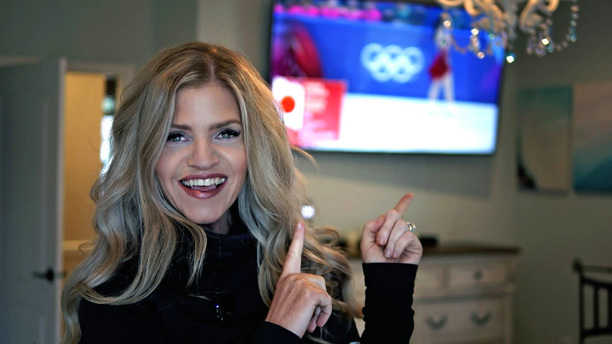Photo courtesy Jennifer Thomas/
Jennifer Thomas watches Japanese skaters Masaya Morita and Utana Yoshida skate to her song Rise of the Phoenix during the Winter Olympics. With their score in the Ice Dance – Rhythm Dance routine for team figure skating, Japan won a silver medal.