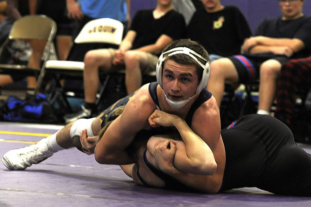 Sequim Gazette file photo by Matthew Nash/
Riley Downs, pictured in a Sequim head-to-head meet earlier this season, will compete at the Mat Classic state 2A meet in the 144-pound bracket.