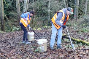 4PA volunteers Kathy and Vern Daugaard pick up litter on the edge of the Tumwater Truck Route this week. 4PA is a nonprofit organization dedicated to a clean and safe community. The efforts of staff and volunteers have resulted in the Touchstone Campus Project, which is being constructed in the 200 block of East First Street, with transitional housing for Port Angeles most vulnerable residents. Those interested in volunteering or donating can visit 4PA.org. (Dave Logan/for Peninsula Daily News)