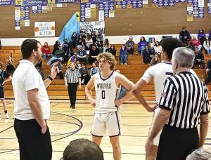 Sequim coach Craig Brooks talks to Zeke Schmadeke (0) and Solomon Sheppard during the game Saturday in Sequim. (Pierre LaBossiere/Peninsula Daily News)