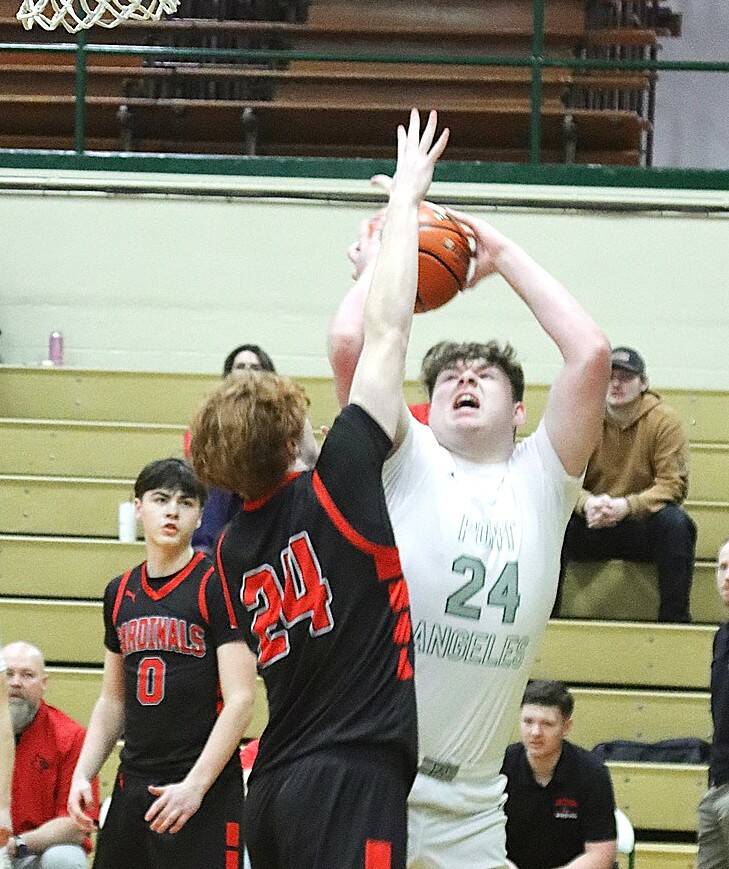 Port Angeles Brock Hope goes up for a shot against the defense of Orting on Saturday in Port Angeles. The Roughriders won 48-33 to move on to the double-elimination phase of the District 3 2A tournament. (Dave Logan/for Peninsula Daily News)