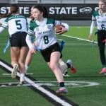 Port Angeles Miriam Cobb carries the ball against Klahowya in the third-place state tournament game Saturday in Federal Way. Port Angeles beat Klahowya 14-0 to finish third in the state in the programs inaugural year of existence. Also in on the play are Port Angeles Pyper Alton (6) and Audrey Rudd (5). (Kevin Hanson/Enumclaw Courier-Herald)