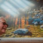 Sequim Gazette file photo by Emily Matthiessen/
Photographer Ross Hamilton, pictured in 2023, reflects on his years of capturing the beauty of the Olympic Peninsula prior to a presentation at the Lodge at Sherwood Village. Several of his photos are displayed throughout the building.