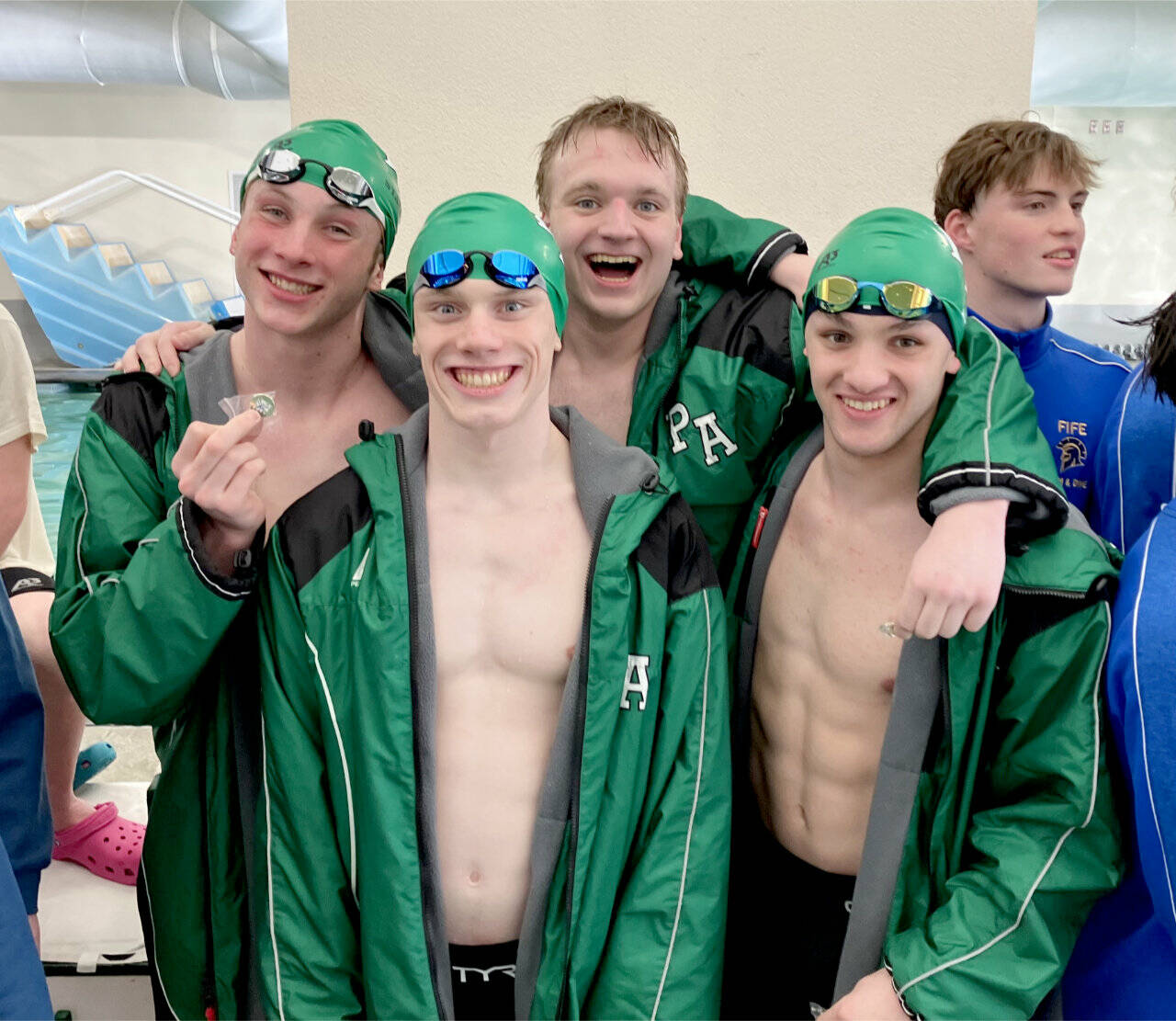 The Port Angeles boys 200-yard medley team of, from left, Miles Van Denburg, Patrick Ross, Thomas Jones and Edward Gillespie, won the District 3 title this weekend at Shore Aquatic Center in Port Angeles. (Sally Cole)