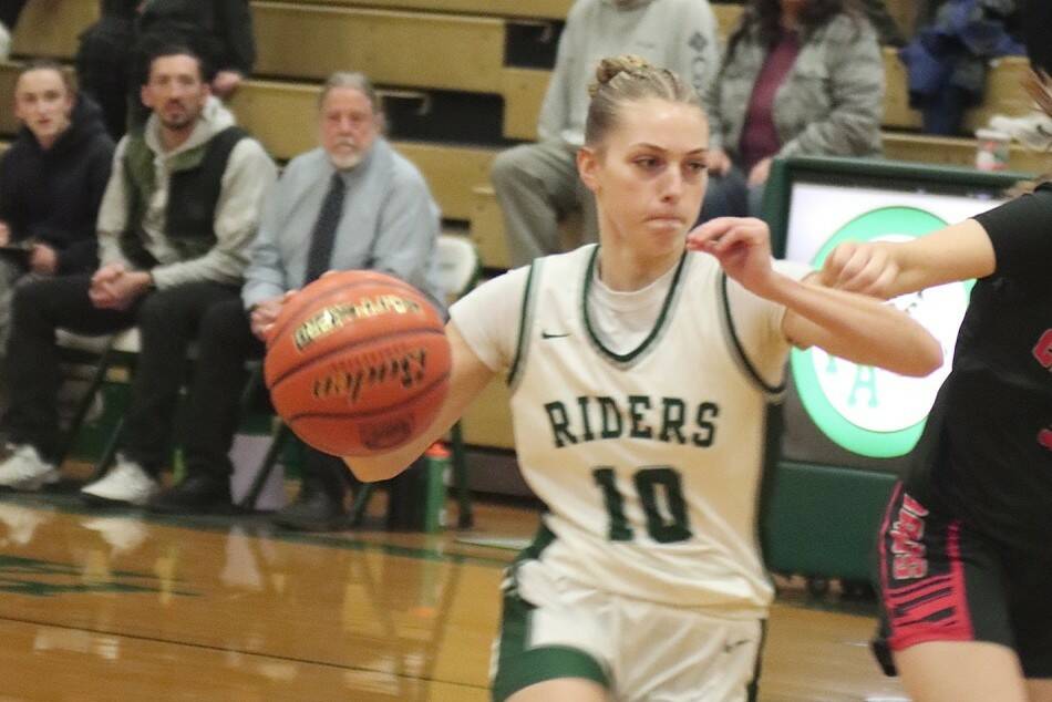 Port Angeles' Teanna Clark, who scored 25 points, drives the ball up the lane against Orting on Wednesday night. The Roughriders won in dominant fashion 63-11. (Dave Logan/for Peninsula Daily News)