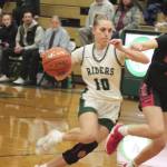 Port Angeles Teanna Clark, who scored 25 points, drives the ball up the lane against Orting on Wednesday night. The Roughriders won in dominant fashion 63-11. (Dave Logan/for Peninsula Daily News)