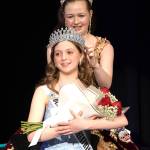 Princess Roxy Woods crowns new princess Caroline Caudle at the Sequim High School auditorium. (Monica Berkseth/Olympic Peninsula News Group)