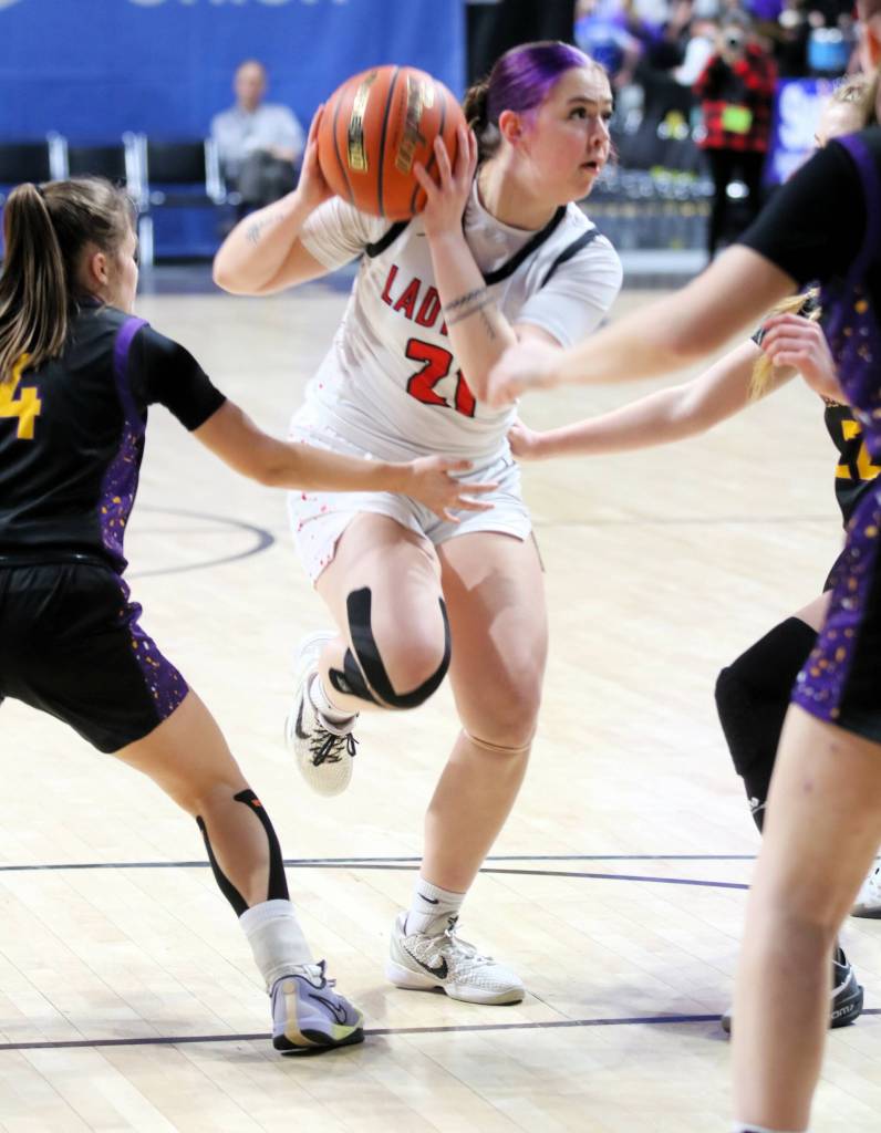 Neah Bays Wiinuk Martin tries to split the Pateros defense during the Class 1B State Girls Basketball Tournament on Thursday at the Spokane Veterans Arena.