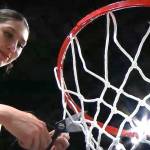 Neah Bays Angel Halttunen cuts down the net after Neah Bay beat Garfield-Palouse 54-41 Saturday night for the 1B state championship. (NFHS Network)