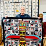 Tom Green of Sequim, a former educator, took up quilting more than 30 years ago. He has a masters degree in art and creates his own quilt patterns. (Nicole Driggs)
