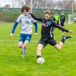 East Jeffersons Rene Martin (25) boots the ball down field and away from South Whidbeys Aedan Fisher in a Tuesday game played in Memorial Field in Port Townsend. The Rivals won 3-2 to improve to 3-0 on the season. (Steve Mullensky/for Peninsula Daily News)