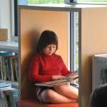 Luna Anderson, 7, reads a book in one of the new nooks inside the childrens area at the Sequim Library on March 21. Her mom, Mayor Rachel Anderson, said shes taken her children to the library since they were born, so its really important to us. (Matthew Nash/Olympic Peninsula News Group)