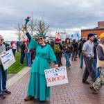 Rhonda Ellis, dressed as Lady Liberty, and her friend Margaret McGaughey, both from Port Townsend, take part in the No Kings rally on Saturday. The nationwide rally, with an estimated 3,000 participants from Port Townsend, started on Sims Way at Boat Haven and ended with a march to Pope Marine Park downtown. (Steve Mullensky/for Peninsula Daily News)