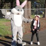 Novella McKinney, 6, is greeted by the Easter bunny during the KONP Easter egg hunt on Saturday. (Dave Logan/for Peninsula Daily News)