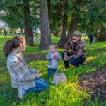 Kayce Khile, 1, shows off an Easter egg he found in the grass to his mom, Kayla, during the 94th Elks Easter Egg hunt on Sunday at Chetzemoka Park in Port Townsend. Dad Keegan continued the tradition of when his parents took him to the hunt when he was young. (Steve Mullensky/for Peninsula Daily News)