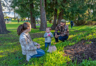 Kayce Khile, 1, shows off an Easter egg he found in the grass to his mom, Kayla, during the 94th Elks Easter Egg hunt on Sunday at Chetzemoka Park in Port Townsend. Dad Keegan continued the tradition of when his parents took him to the hunt when he was young. (Steve Mullensky/for Peninsula Daily News)