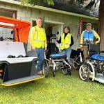 Sequim Wheelers volunteers, from left, Ron and Tanya Baumgardner and Tom Coonelly stand with three of the adaptive bikes in the nonprofits fleet. They and 70-plus other volunteers provide free rides to those who are unable to ride a bike on their own. The bikes are made by Dutch business vanRaam, and each volunteer receives at least six hours of training a year on the bikes. (Matthew Nash/Olympic Peninsula News Group)