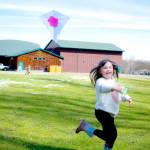 Claire Packer, 6, of Sequim, flies a kite she made at the Friendship Garden open house event at Carrie Blake Community Park. (Monica Berkseth/Olympic Peninsula News Group)