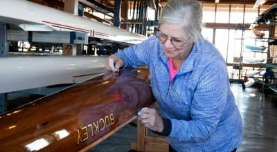 I like working on them. These are my babies, said Sally Giesler, a 20-year member of the Rat Island Rowing Club in Port Townsend, as she wipes down the clubs quad scull Buckley, a George Pocock boat built in the early 1960s after a row on Port Townsend Bay. Pocock is the builder of the famed Husky Clipper that was in the 1936 Berlin Summer Olympics that won the gold for the University of Washington rowing team and inspired the best-selling book The Boys in the Boat in addition to the 2023 movie by the same name. (Steve Mullensky/for Peninsula Daily News)