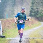 Darcy Schultz of Sequim powers through the rain, winning her half-marathon 60-69 age group of the Olympic Adventure Trail run. (Peninsula Adventure Sports)