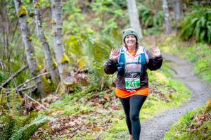 Amy German of Port Angeles competes in the half-marathon at the Peninsula Adventure Sports Olympic Adventure Trail run Saturday. (Jesse Major/Peninsula Adventure Sports)