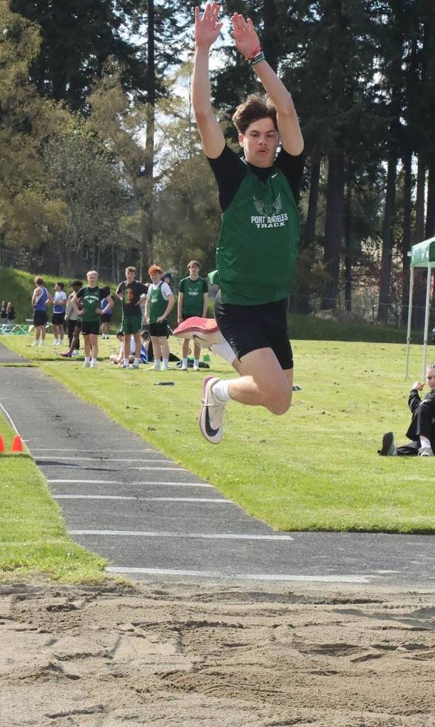 Dave Logan/for Peninsula Daily News 
Riders senior Brody Pierce swept the jump events in a five-school track and field meet at Port Angeles High School.