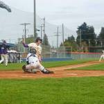 Port Angeles Carson Waddell blocks the plate against North Kitsap but the ball gets away from him and the run scored. Waddell later had a huge play at the plate in the seventh inning to help send the game to extra innings. (Pierre LaBossiere/Peninsula Daily News)