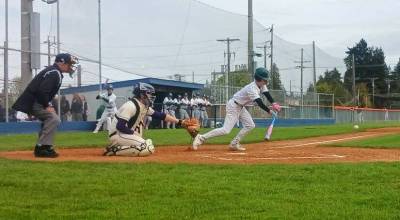 Port Angeles Parker Pavlak successfully lays down a sacrifice bunt against North Kitsap at Civic Field in Port Angeles on Friday. Pavlak drove in the winning run with a sacrifice fly in the bottom of the eighth inning for a 6-5 victory over the Vikings. (Pierre LaBossiere/Peninsula Daily News)