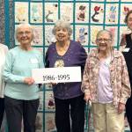 As part of their 40th anniversary celebration, Sunbonnet Sue Quilt Club members took group photos of club members by the decade they joined. For 1986-1995, club members include, from left, Joanne Thoma, Nancy Davis, Alicia Crawford, Marilyn Bosckis and Norma Herbold. (Matthew Nash/Olympic Peninsula News Group)
