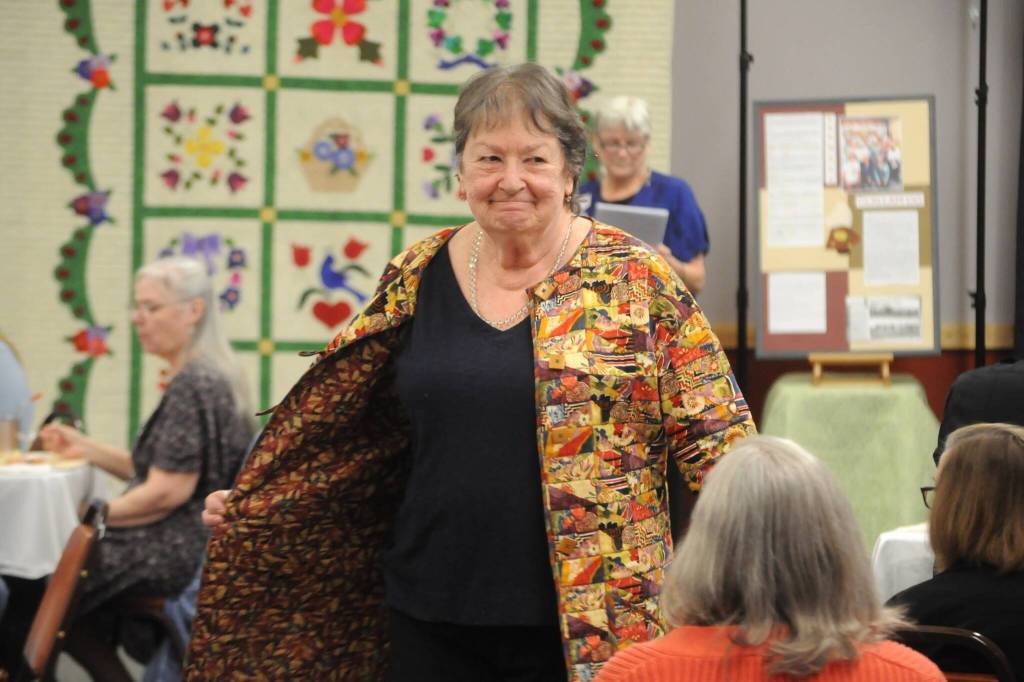Mary-Lou Giacomelli, club president for the Sunbonnet Sue Quilt Club, models an outfit during the Wearable Fashion Show. (Matthew Nash/Olympic Peninsula News Group)